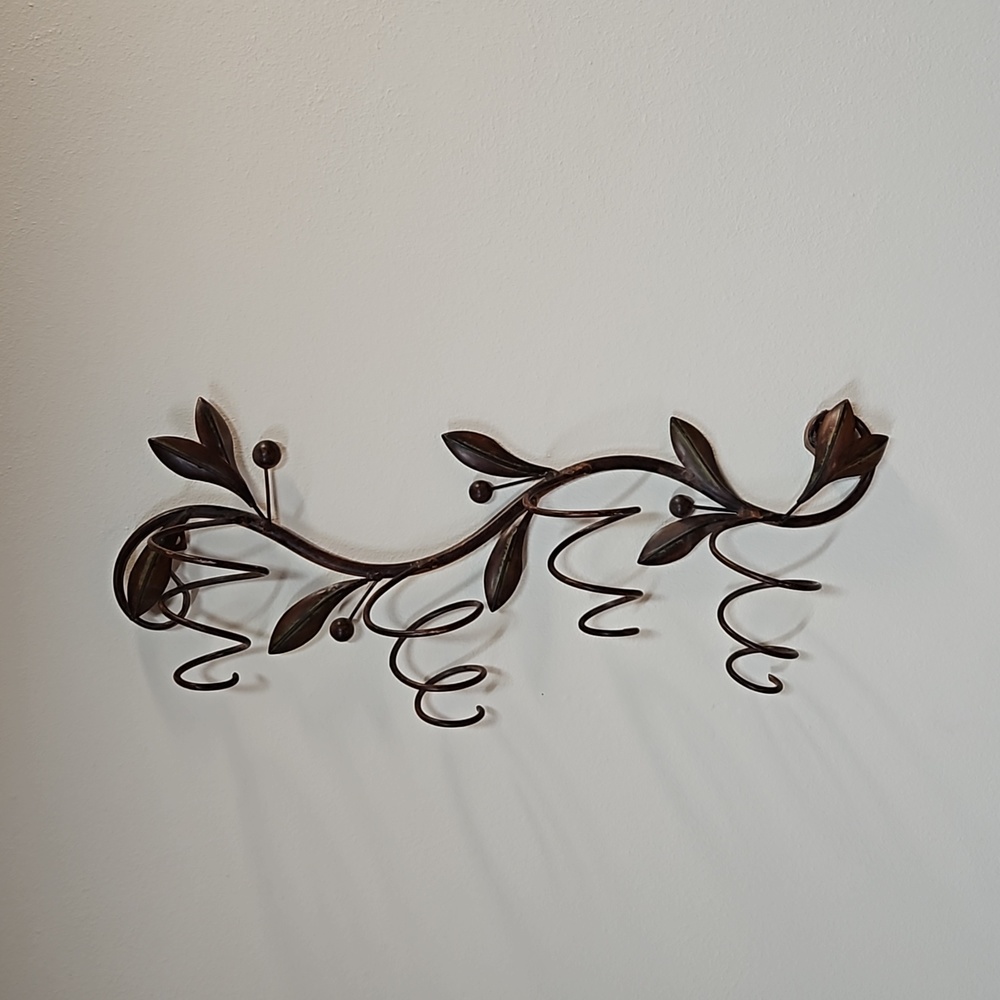 Rubbed bronze wine holder